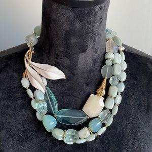 Trifari necklace crown over the T followed by a C. Aqua stones